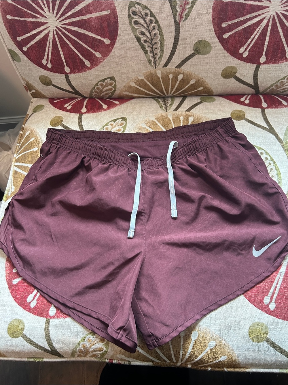 Nike size Medium running shorts with zip pocket in back. Fully lined.